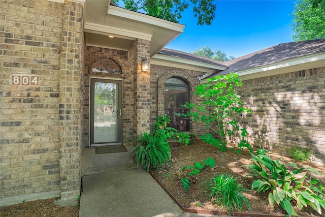 804 Park Hill Dr, Euless, TX 76040 - property entrance featuring brick siding and a shingled roof