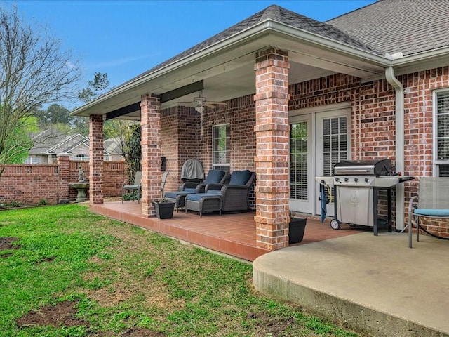 view of patio / terrace with a wooden deck, ceiling fan, a grill, outdoor lounge area, and fence