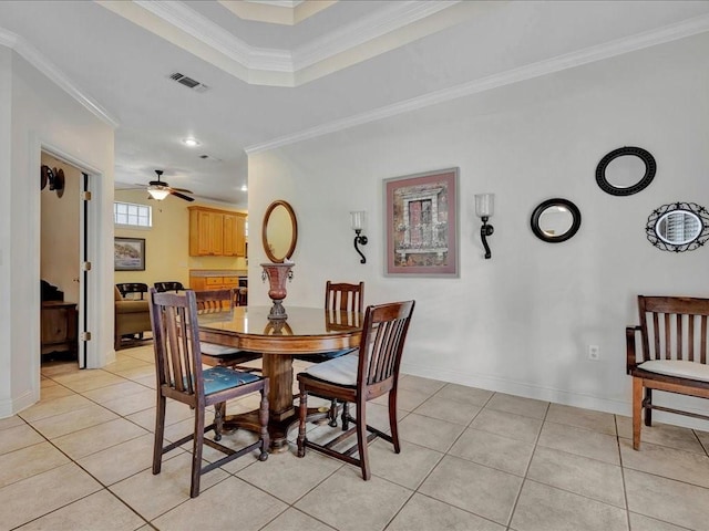 dining space with ornamental molding, light tile patterned floors, and visible vents