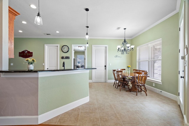 104 Petes Ln, Ponder, TX 76259 - kitchen with dark countertops, ornamental molding, light tile patterned flooring, recessed lighting, and baseboards