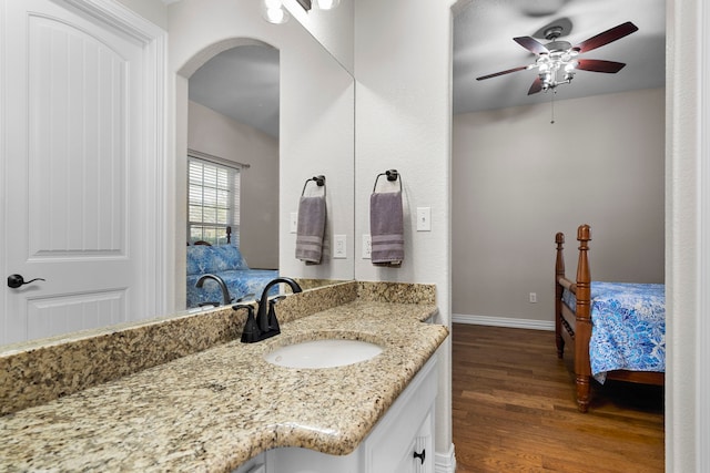 104 Petes Ln, Ponder, TX 76259 - bathroom with wood finished floors, a ceiling fan, baseboards, and vanity