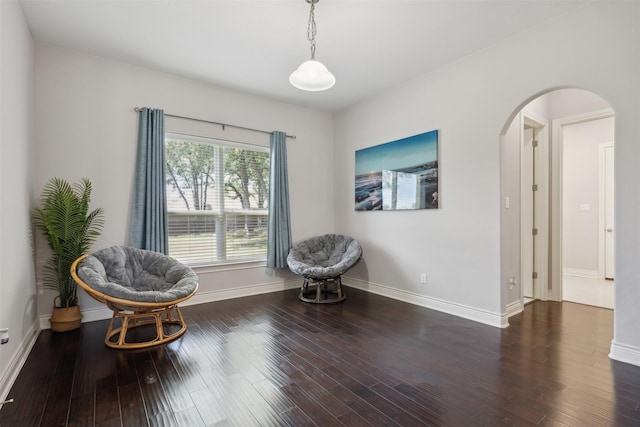 140 Dogwood Dr, Krugerville, TX 76227 - living area with arched walkways, baseboards, and wood finished floors