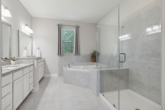 140 Dogwood Dr, Krugerville, TX 76227 - bathroom with a garden tub, a shower stall, tile patterned flooring, baseboards, and vanity