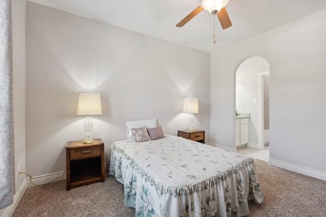 140 Dogwood Dr, Krugerville, TX 76227 - bedroom with ensuite bath, light colored carpet, arched walkways, and baseboards