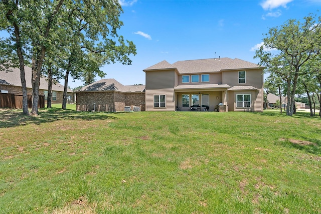 140 Dogwood Dr, Krugerville, TX 76227 - rear view of property featuring a lawn and fence