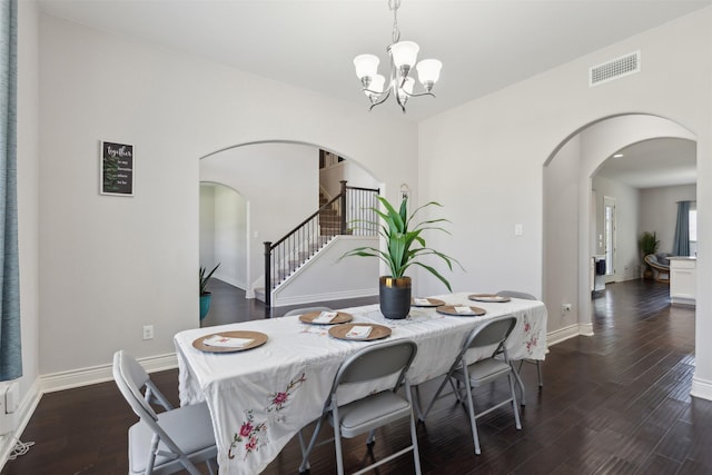 140 Dogwood Dr, Krugerville, TX 76227 - dining room with visible vents, a notable chandelier, dark wood-style floors, arched walkways, and stairs