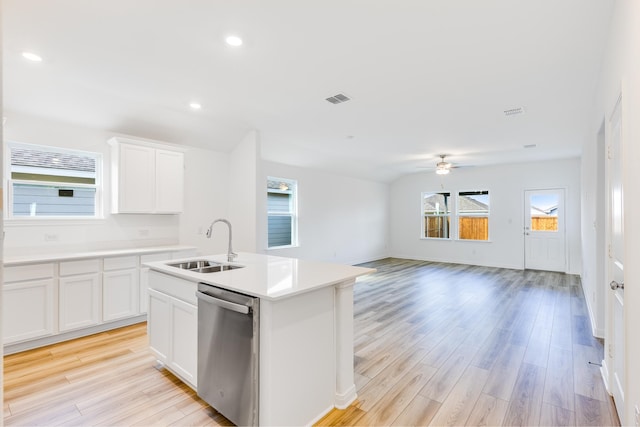 kitchen featuring stainless steel dishwasher, light wood-style flooring, a sink, and ceiling fan