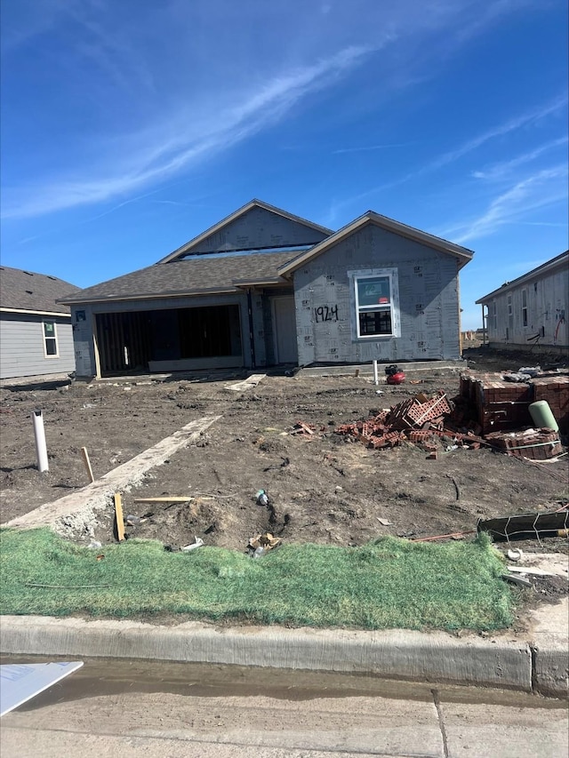 property in mid-construction featuring an attached garage
