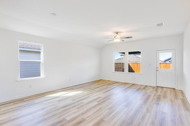 unfurnished room with light wood-style floors, baseboards, visible vents, and ceiling fan