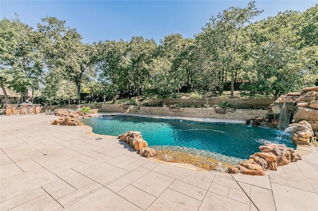 view of pool featuring a patio area, a fenced in pool, and fence
