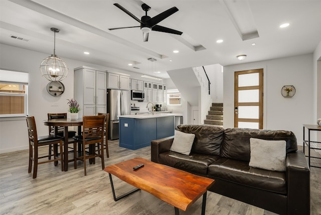 3725 Toronto St, Dallas, TX 75212 - living area with visible vents, stairway, light wood-type flooring, recessed lighting, and ceiling fan with notable chandelier