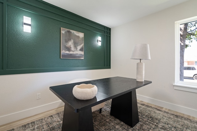 office area featuring wood finished floors and baseboards