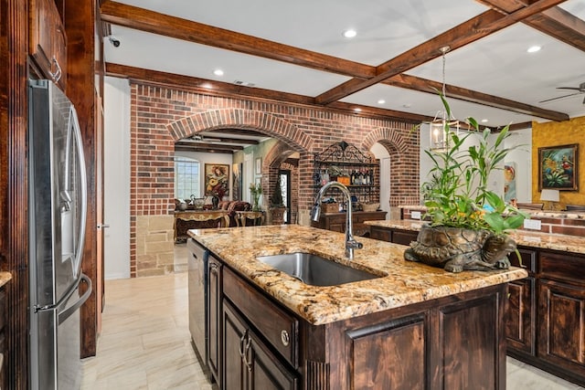 17909 Terrace Dr, Kemp, TX 75143 - kitchen with beamed ceiling, a center island with sink, open floor plan, stainless steel appliances, and a sink