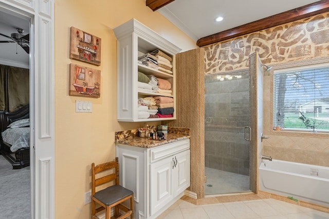 17909 Terrace Dr, Kemp, TX 75143 - full bathroom with tile patterned flooring, ceiling fan, a stall shower, and a garden tub