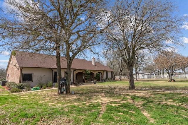 17909 Terrace Dr, Kemp, TX 75143 - view of front of property featuring fence, roof with shingles, a chimney, a front lawn, and brick siding