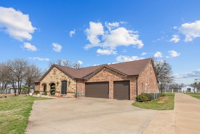 17909 Terrace Dr, Kemp, TX 75143 - view of front of property with fence, concrete driveway, a front lawn, a garage, and brick siding