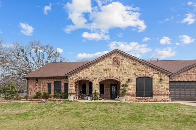 17909 Terrace Dr, Kemp, TX 75143 - french country inspired facade with a front lawn, an attached garage, and brick siding