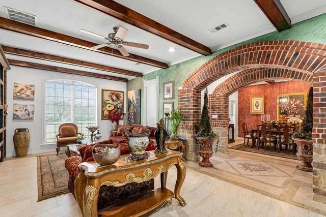 17909 Terrace Dr, Kemp, TX 75143 - living room with beamed ceiling, arched walkways, visible vents, and ceiling fan