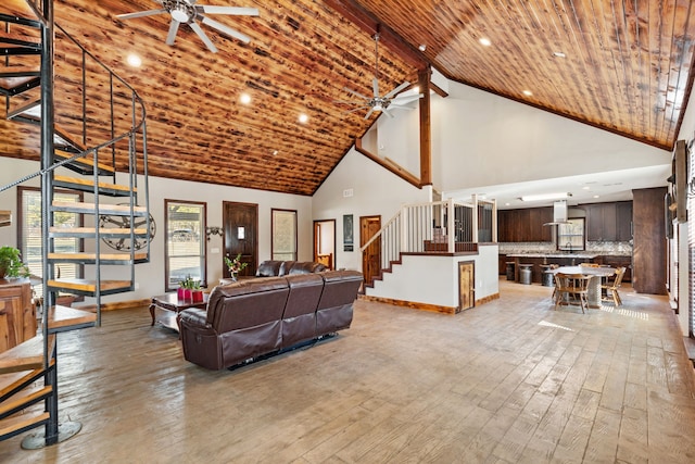 living room with light wood-style flooring, wood ceiling, ceiling fan, and stairs