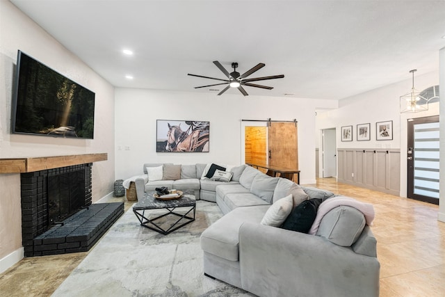 tiled living area with recessed lighting, a brick fireplace, and a ceiling fan