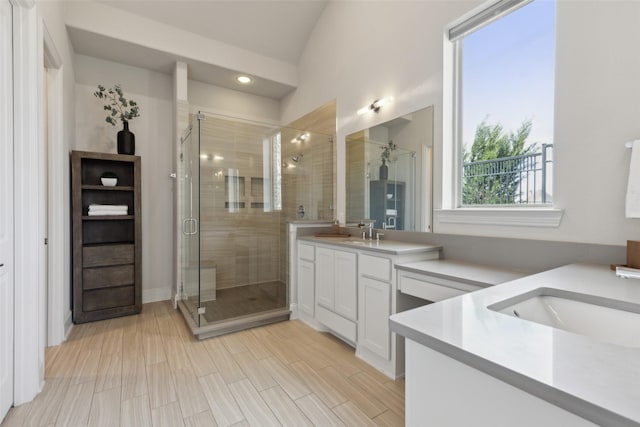 bathroom with a stall shower and vanity