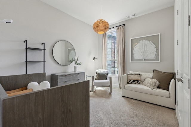 interior space featuring light carpet, visible vents, and baseboards