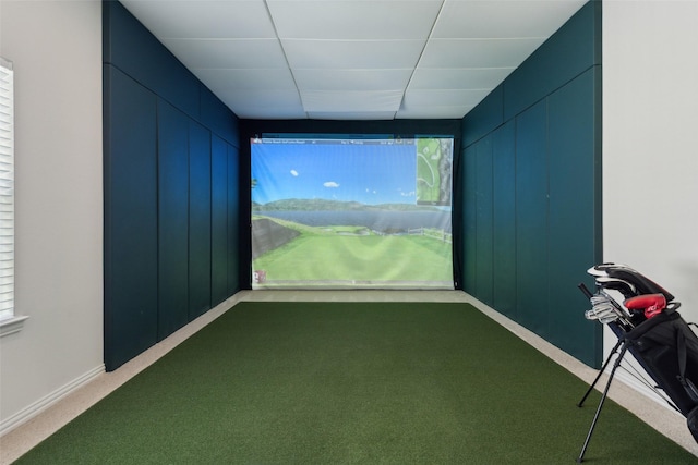 rec room featuring dark carpet, baseboards, and golf simulator