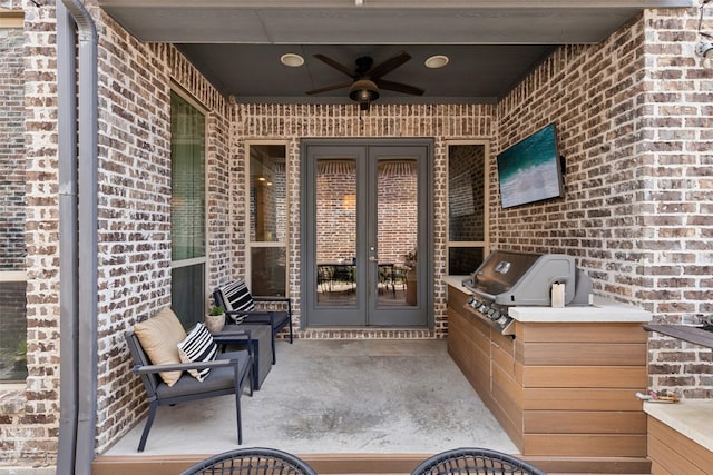 view of patio / terrace with a grill, french doors, and a ceiling fan