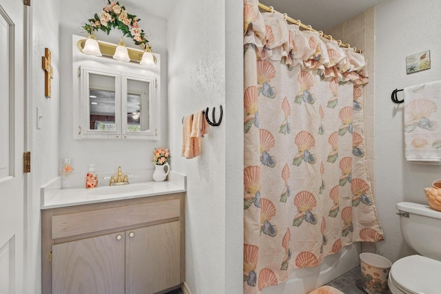 bathroom with vanity, toilet, and shower / tub combo with curtain
