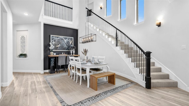 1017 Wrenwood Dr, Justin, TX 76247 - dining space featuring wood finished floors, stairs, and a high ceiling