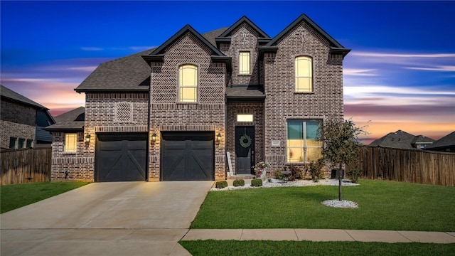 1017 Wrenwood Dr, Justin, TX 76247 - french country style house with driveway, brick siding, a shingled roof, and a garage