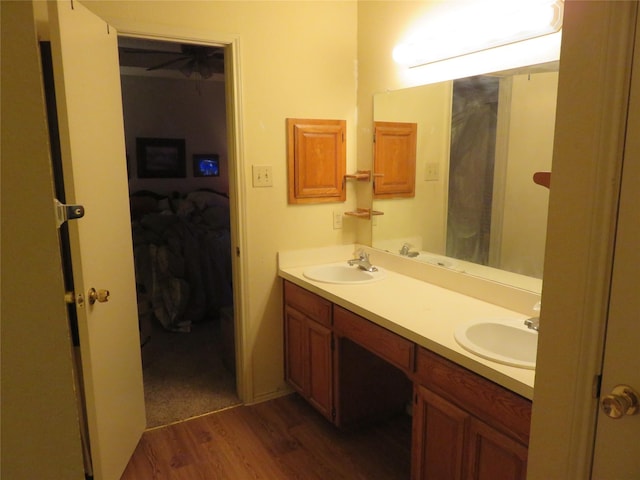 313 Conger Dr, Mesquite, TX 75149 - bathroom with double vanity, a sink, and wood finished floors