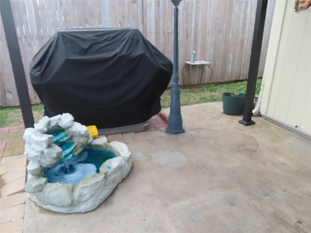 313 Conger Dr, Mesquite, TX 75149 - view of patio featuring fence and a grill