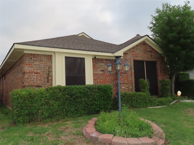 313 Conger Dr, Mesquite, TX 75149 - view of front of property with roof with shingles, a front lawn, and brick siding