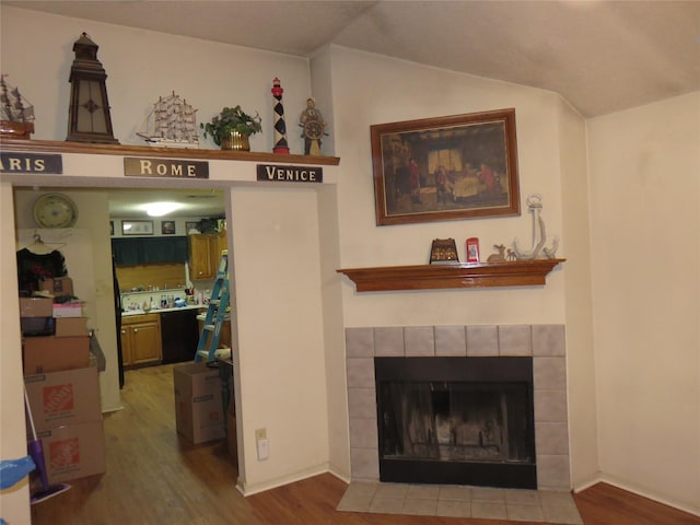 313 Conger Dr, Mesquite, TX 75149 - living area featuring wood finished floors, lofted ceiling, and a fireplace