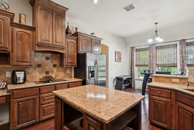 kitchen featuring stainless steel fridge with ice dispenser, dark wood finished floors, open shelves, visible vents, and black electric cooktop