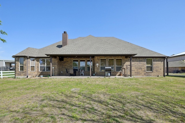 532 Hubbard Cir, Nevada, TX 75173 - rear view of property featuring brick siding, a chimney, a patio, and a shingled roof