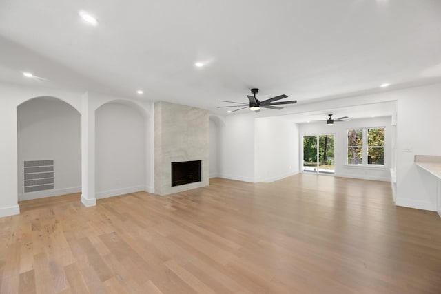 9805 Bluff Dale Dr, Dallas, TX 75218 - unfurnished living room featuring visible vents, a ceiling fan, recessed lighting, light wood finished floors, and a premium fireplace
