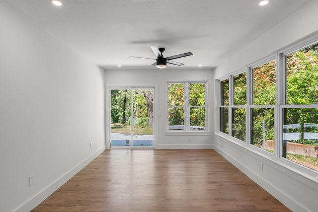 9805 Bluff Dale Dr, Dallas, TX 75218 - unfurnished sunroom featuring wood finished floors, baseboards, a deck, and recessed lighting