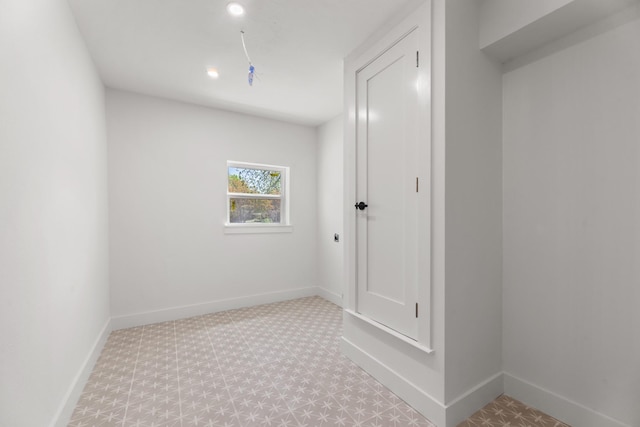 9805 Bluff Dale Dr, Dallas, TX 75218 - spare room with tile patterned floors, baseboards, and recessed lighting