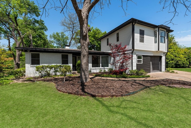 9805 Bluff Dale Dr, Dallas, TX 75218 - view of front of house with an attached garage, concrete driveway, a front yard, and brick siding