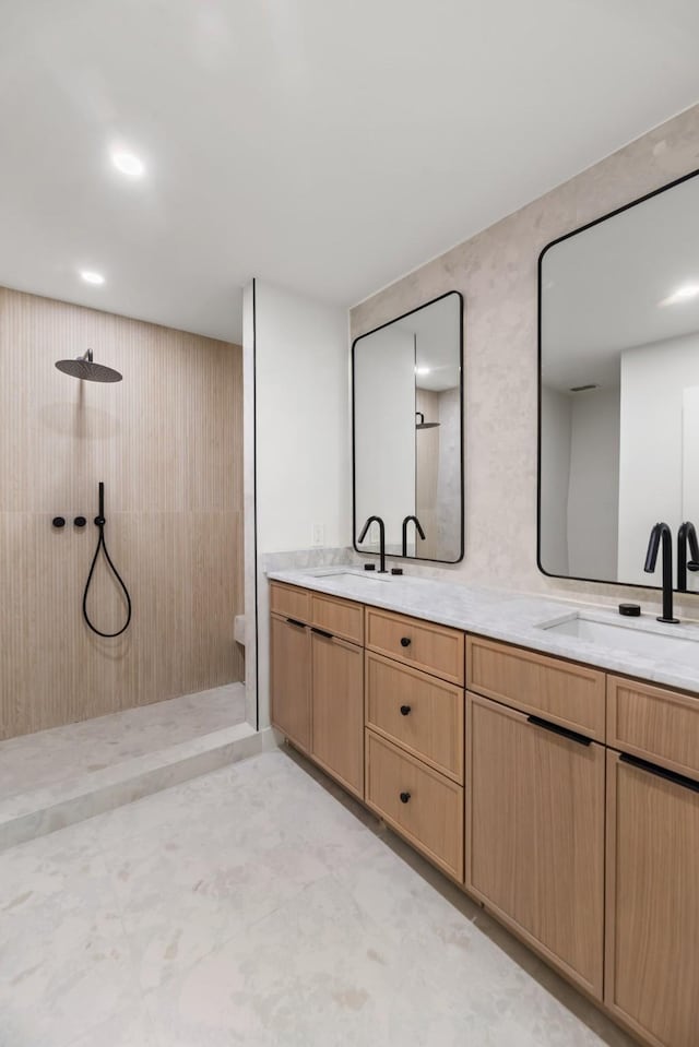 9805 Bluff Dale Dr, Dallas, TX 75218 - full bathroom with double vanity, a sink, and walk in shower