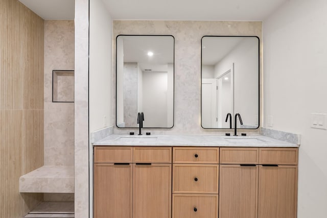 9805 Bluff Dale Dr, Dallas, TX 75218 - bathroom with a tile shower, double vanity, and a sink