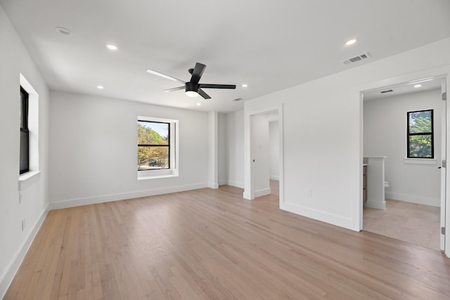 9805 Bluff Dale Dr, Dallas, TX 75218 - interior space with visible vents, light wood-type flooring, and multiple windows