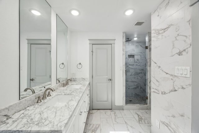 4108 Desert Garden Dr, Plano, TX 75093 - bathroom featuring marble finish flooring, a marble finish shower, recessed lighting, and double vanity