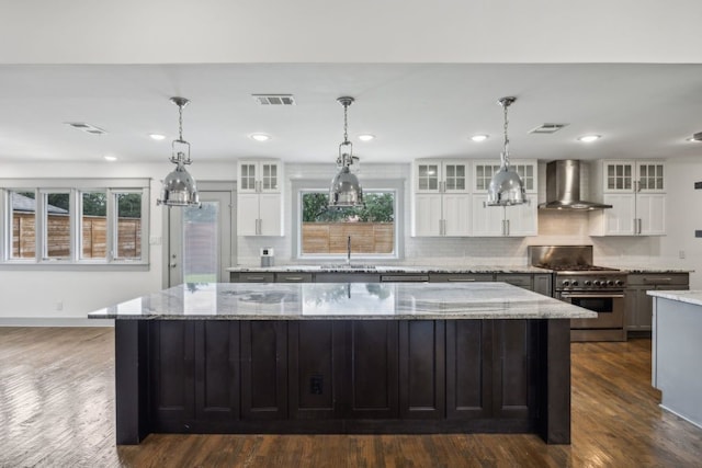4108 Desert Garden Dr, Plano, TX 75093 - kitchen featuring wall chimney exhaust hood, high end stainless steel range oven, a sink, a large island, and tasteful backsplash