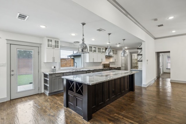 4108 Desert Garden Dr, Plano, TX 75093 - kitchen featuring a sink, plenty of natural light, white cabinets, recessed lighting, and ornamental molding