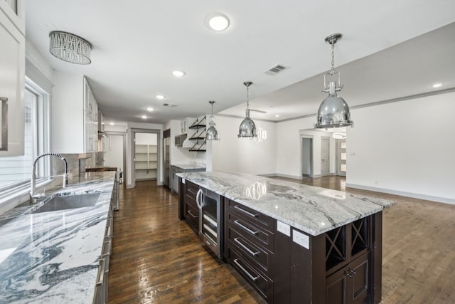 4108 Desert Garden Dr, Plano, TX 75093 - kitchen featuring a sink, beverage cooler, dark wood-style flooring, recessed lighting, and dark brown cabinets