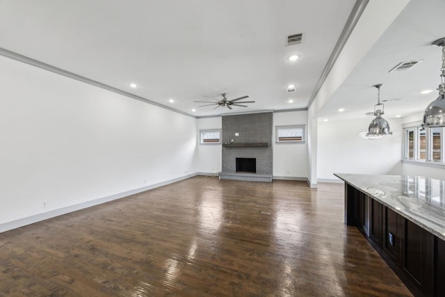 4108 Desert Garden Dr, Plano, TX 75093 - unfurnished living room featuring a ceiling fan, a fireplace, recessed lighting, ornamental molding, and wood finished floors