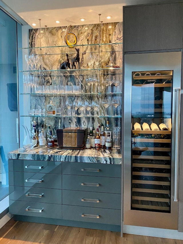 3130 N Harwood St Unit 1404, Dallas, TX 75201 - indoor bar with wine cooler and wood finished floors